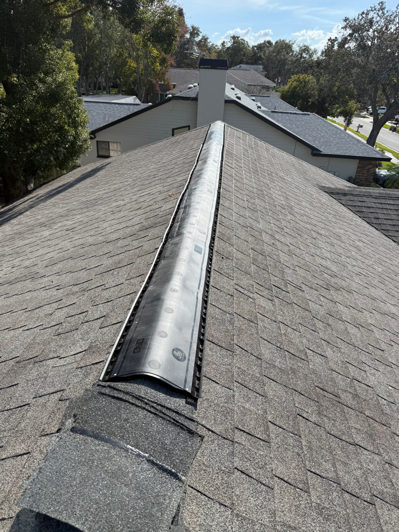 Shingle roof repair. Ridge vent replacement. weathered wood ridge cap photo 3